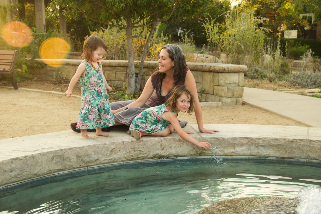 mother and daughters near fountain in Cluff Vista Park Ojai, California